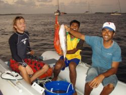 boys fishing on a boat