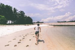 man running on the beach