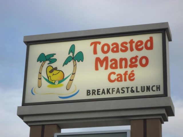 sign for the toasted mango